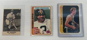 lot 272 image: Three Vintage Misc. Sports Cards Including 1978 Topps Terry Bradshaw, 1949 Reamr Bread Mel Duezabou And 1986 Fleer Larry Bird In Protective Sleeves