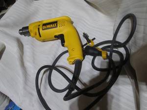 lot 5 image: Dewalt electric 38 VSR Drill with...