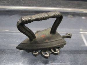 lot 109 image: Mini Sad Iron & Trivet