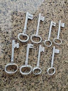 lot 320 image: Eight Silver Painted Cast Iron Keys