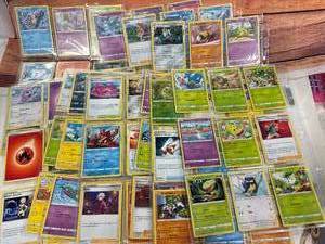 Many Pages of Pokemon Trading Cards