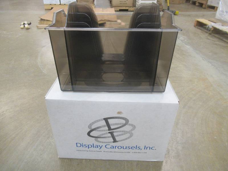 lot 122 image: Pallet of 44 Display Carousels Inc. Magazine Holders, New Approximate Dimensions 14 x 11 x 11.