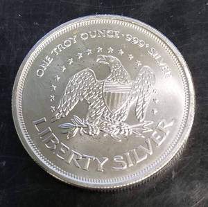 lot 56 image: 1 TROY OZ .999 FINE SILVER AMARK LIBERTY ROUND