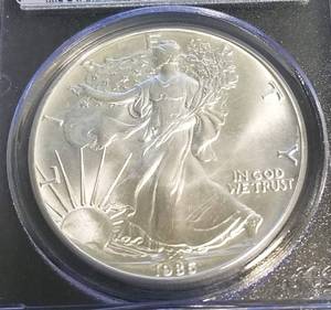 lot 57 image: 1986 AMERICAN SILVER EAGLE 1 TROY OZ MS69 PCGS