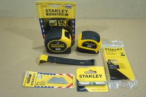 lot 214 image: Assorted Stanley Tools -Tape Measures, Mini Crow Bar, Level, Blades, Glue Sticks