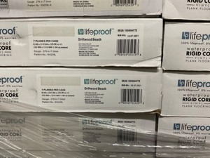 lot 13 image: 10 boxes Lifeproof Rigid Core Vinyl Plank Flooring - Driftwood Beach