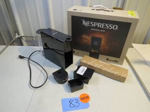 lot 83 image: Nespresso Essenza Mini Espresso Machine by Breville