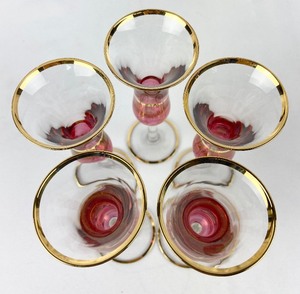 lot 10 image: Set of 5 Vintage Cranberry & Gold Cordial Stemware
