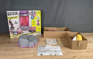 lot 143 image: Graphic Skinz Design Studio Motorized Vacuum Chamber by Mega Brands K