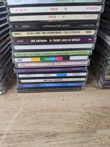 lot 97 image: Large Collection of CDs Bryan Adams, Joe Satriani, Pentatonix, Ricky Martin, INXS, David Bowie, Eric Johnson, Wilson Phillips, The Blenders, Empire of The Sun, Christmas Celebration, Tis the Season and Much More