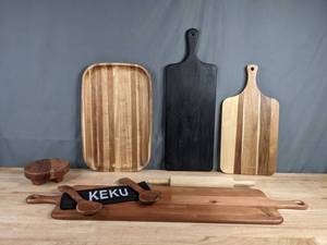 lot 220 image: Collection of 7 Wood Serving Pieces, Including Keku Salad Serving SEt, Charcuterie Board, Chateau Cheeseboard, Paddle Serve Board and More F