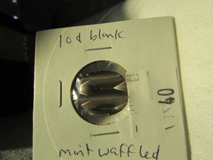 lot 40 image: 10 CENT BLANK WAFFLED COIN, MINT ERROR