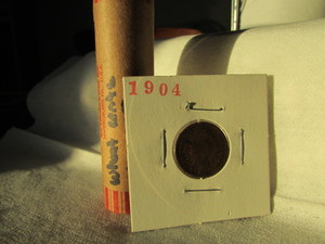 lot 83 image: ROLL OF MIXED DATE WHEAT CENTS 1909-1958 (SILVER MERCURY DIME SHOWING) WITH A 1904 INDIAN HEAD CENT