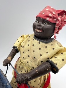 lot 14 image: Vintage Nomas Mammy with Charge  Black Americana Aunt Jemima Walker Pull Toy