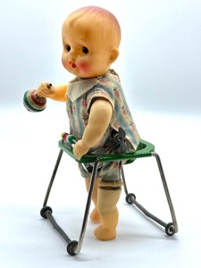 lot 129 image: Vintage Wind Up Toy Baby in Walker