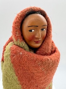 lot 12 image: Vintage Antique Skookum Doll and Woven Pine Needle Basket