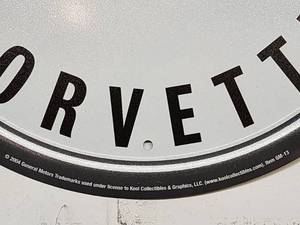 lot 99 image: 12 Round Tin Metal Corvette Sign