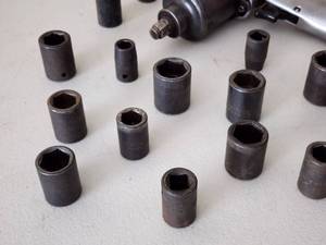 lot 152 image: Air Impact Wrench with Assorted Hardened Sockets