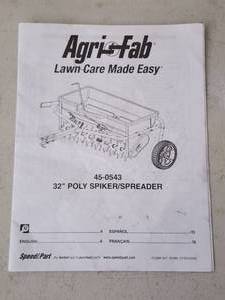 lot 89 image: Black Pull Behind ATV  Riding Lawn Mower Lawn Seed  Fertilizer Aerator Attachment