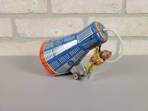 lot 310 image: 1960s KANTO Toys  Space Capsule w Astronaut Tin Litho Friction Toy - WORKS