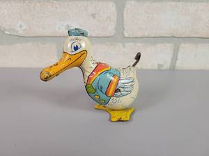 lot 311 image: Vintage J. Chein Waddling Duck Wind-up Tin Toy - WORKS