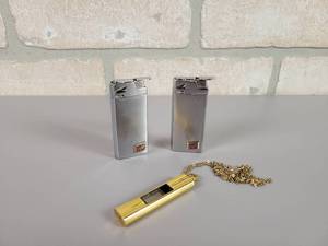 lot 319 image: (2) ALBEE Schlitz Lighters and Watch Necklace
