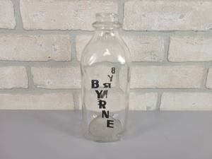lot 427 image: BYRNE Quart Glass Milk Bottle