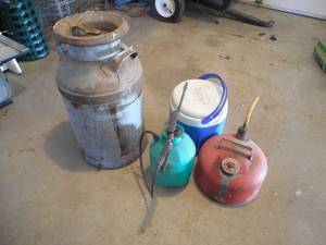 lot 12 image: Cream Can , Cooler, Gas can jug lot