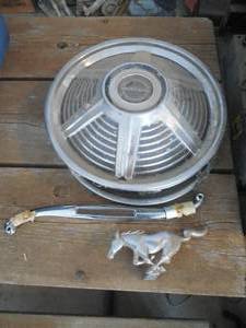 lot 68 image: Antique Mustang Set of Hub Caps with Logo
