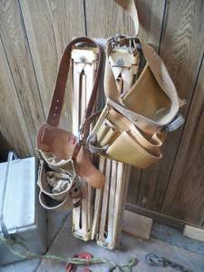 lot 126 image: set of saw horses & tool belt