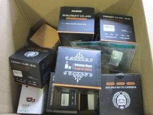box of whiskey glasses and coffee c...