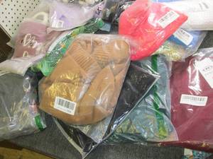 box of womens sweaters , shirts dre...