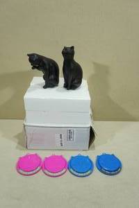 lot 91 image: 4 Cat Food Can Covers with 2 Cat Statues