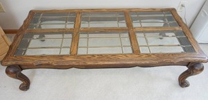 Very large coffeeentertainment table with six leadedbeveled glass removable inserts.