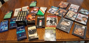Assorted DVDs and VHS tapes including the Johnny Carson collection, John Wayne, Willie, McQuade Legends of the West, Big Jake, Gods Gone, etc.