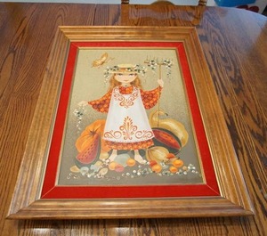Amazing retro painting on board by Lola Cabot of a farmer girl surrounded by fruits, gourds, and a friendly butterfly.
