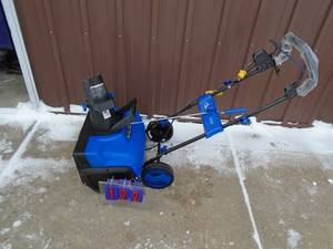 lot 102 image: SnowJoe 110 volt snow thrower. Looks new but cords were cut & repaired. Tested & works. As shown.