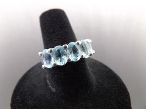 lot 56 image: .925 Sterling Silver Oval Cut Topaz Ring Size 8