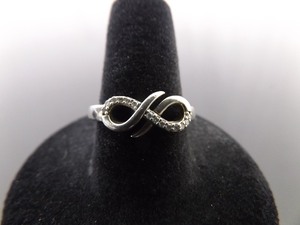 lot 78 image: .925 Sterling Silver Diamond Accented Infinity Ring Size 7.75