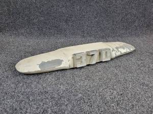 lot 1213 image: Vintage Cast Aluminum Tractor() 370 Emblem