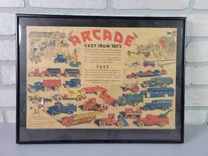 lot 1183 image: ARCADE Cast Iron Toys COLOR Framed Ad