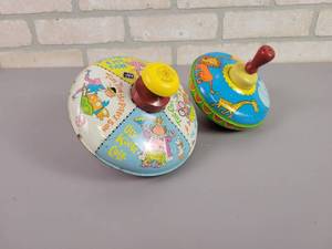 lot 1191 image: (2) Vintage Pressed Steel Litho Tops