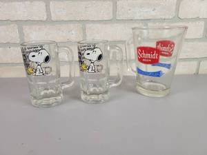 lot 1234 image: Vintage Glass Schmidt Beer Pitcher and (2) Heavy Glass Snoopy Beer Mugs