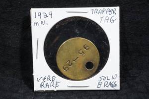 lot 63 image: 1929 Minnesota Brass Trapper Tag