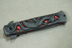 lot 146 image: Dragon Engraved Spring Assisted Folding Pocket knife