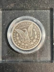1899-O MORGAN SILVER DOLLAR IN GLASS CASING