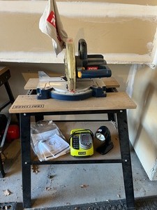 lot 4 image: Ryobi Compound Miter Saw MS-180, Table, Cordless Worklight, and Battery