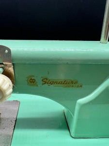 lot 14 image: Vintage West Germany Signature Jr. Childs Toy Sewing Machine