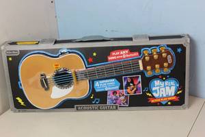 lot 105 image: My Real Jam Acoustic Guitar Toy