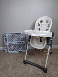 White Highchair and Plastic Baby Gate